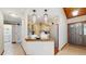 Bright kitchen with light wood cabinets, breakfast bar, and stainless-steel appliances at 7523 4Th W Ave # 7523, Bradenton, FL 34209
