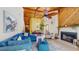 Open-concept living space with fireplace and comfortable seating adjacent to dining area at 7523 4Th W Ave # 7523, Bradenton, FL 34209