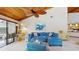 Comfortable living room with natural light and vaulted wood ceilings, creating a cozy atmosphere at 7523 4Th W Ave # 7523, Bradenton, FL 34209