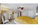 Spacious main bedroom showcasing a ceiling fan, chest of drawers, and closet at 7523 4Th W Ave # 7523, Bradenton, FL 34209