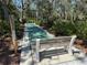 Enjoy a leisurely game of shuffleboard surrounded by verdant landscaping and benches for relaxation at 7523 4Th W Ave # 7523, Bradenton, FL 34209