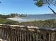 View of the water and docks from the balcony near lush green plants at 7523 4Th W Ave # 7523, Bradenton, FL 34209