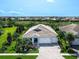 Expansive aerial view of a home showcasing its well-manicured lawn and a serene neighborhood at 813 Tailwind Pl, Sarasota, FL 34240