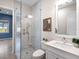 Modern bathroom featuring a glass-enclosed shower and bright white vanity at 813 Tailwind Pl, Sarasota, FL 34240