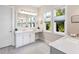 Beautiful bathroom with a vanity, large mirror, and natural light from windows at 813 Tailwind Pl, Sarasota, FL 34240