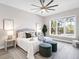 A tranquil bedroom with a king bed and a view of the pool at 813 Tailwind Pl, Sarasota, FL 34240