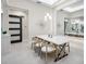 Contemporary dining area with a modern light fixture and natural light at 813 Tailwind Pl, Sarasota, FL 34240
