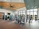 Well-equipped gym with modern machines, large windows, and scenic lake views at 813 Tailwind Pl, Sarasota, FL 34240