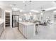 Open concept kitchen features a large island, stainless appliances, and leads into the living room at 813 Tailwind Pl, Sarasota, FL 34240