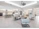 Spacious living room with an open floor plan, modern decor, and abundant natural light at 813 Tailwind Pl, Sarasota, FL 34240