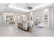 Spacious living room with high ceilings, neutral colors, and an open layout at 813 Tailwind Pl, Sarasota, FL 34240