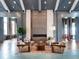Inviting lounge area featuring comfortable seating and a modern fireplace, creating an elegant and cozy atmosphere at 813 Tailwind Pl, Sarasota, FL 34240
