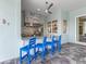Outdoor kitchen with granite countertops, stainless steel grill and seating for entertaining at 813 Tailwind Pl, Sarasota, FL 34240