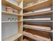 Walk in pantry with custom shelving and pull out drawers for organization and ample storage at 813 Tailwind Pl, Sarasota, FL 34240