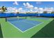 Outdoor pickleball courts surrounded by lush landscaping, ready for a match at 813 Tailwind Pl, Sarasota, FL 34240
