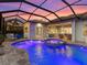 Tranquil pool and patio area, perfect for evening relaxation with its ambient lighting and comfortable seating at 813 Tailwind Pl, Sarasota, FL 34240