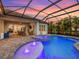 Inviting backyard pool with a built-in spa, an extended covered patio, and seating for outdoor enjoyment at 813 Tailwind Pl, Sarasota, FL 34240