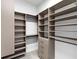 Spacious walk-in closet with built-in shelving, drawers and clothing rods for optimal organization at 813 Tailwind Pl, Sarasota, FL 34240