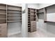 A spacious walk-in closet with custom shelving and drawers for organization at 813 Tailwind Pl, Sarasota, FL 34240