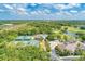 Aerial view showcasing the community's amenities, including the pool, tennis courts, and golf course at 8782 49Th E Ter, Bradenton, FL 34211