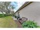 Outdoor view of a backyard with a patio, grill, and seating area, perfect for entertaining at 8782 49Th E Ter, Bradenton, FL 34211