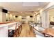 The cozy bar area has stylish seating, warm lighting, and wood floors at 8782 49Th E Ter, Bradenton, FL 34211