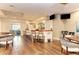 Relaxing bar area features comfortable seating and a fully stocked bar with wood flooring at 8782 49Th E Ter, Bradenton, FL 34211
