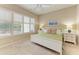 Cozy bedroom with a queen-sized bed, white nightstands, plantation shutters and ceiling fan at 8782 49Th E Ter, Bradenton, FL 34211