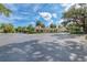 Exterior shot of the elegant clubhouse with manicured landscaping and ample parking under a sunny sky at 8782 49Th E Ter, Bradenton, FL 34211