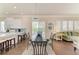 Bright dining room boasts tile floors, modern light fixture, and access to the kitchen at 8782 49Th E Ter, Bradenton, FL 34211