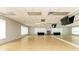 Bright fitness center featuring hardwood floors, mirrors, and open space at 8782 49Th E Ter, Bradenton, FL 34211