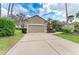 Charming home features a well-manicured lawn, lush landscaping, and a two-car garage at 8782 49Th E Ter, Bradenton, FL 34211