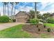 Charming home features a well-manicured lawn, lush landscaping, and a two-car garage at 8782 49Th E Ter, Bradenton, FL 34211