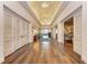 Lobby hallway features wood floors, neutral walls, and elegant doors at 8782 49Th E Ter, Bradenton, FL 34211