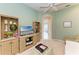 Comfortable sitting room featuring a television, natural light, and stylish decor at 8782 49Th E Ter, Bradenton, FL 34211