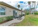 Outdoor patio area with seating, a grill, and a view of the well-maintained backyard at 8782 49Th E Ter, Bradenton, FL 34211
