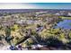 Aerial view of a large neighborhood with a series of ponds at 922 Fernleaf Run, Bradenton, FL 34212