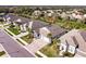 Aerial view of a home surrounded by manicured lawns and palm trees at 922 Fernleaf Run, Bradenton, FL 34212