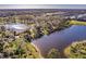 Beautiful aerial view of community ponds, lush trees, and neighborhood homes at 922 Fernleaf Run, Bradenton, FL 34212