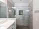 Modern bathroom with a glass-enclosed shower featuring a shower head and tiled walls at 922 Fernleaf Run, Bradenton, FL 34212