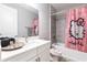 Charming bathroom featuring vanity, mirror, toilet, tub, and a Hello Kitty shower curtain at 922 Fernleaf Run, Bradenton, FL 34212