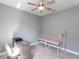 The bedroom features a ceiling fan, neutral walls, and a furniture at 922 Fernleaf Run, Bradenton, FL 34212