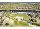 Charming home with manicured lawn, mature landscaping, and waterfront access at 922 Fernleaf Run, Bradenton, FL 34212