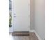 Welcoming foyer with a storm door and neutral paint at 922 Fernleaf Run, Bradenton, FL 34212