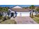 Charming single-story home with a wide driveway and a 3-car garage at 922 Fernleaf Run, Bradenton, FL 34212