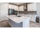 Modern kitchen with stainless steel appliances, ample counter space, and stylish white cabinetry at 922 Fernleaf Run, Bradenton, FL 34212