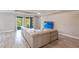 Bright open concept living space with tile floors and a large sectional couch at 922 Fernleaf Run, Bradenton, FL 34212