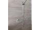 Close up of a shower with tiled walls and a hand held shower head at 922 Fernleaf Run, Bradenton, FL 34212
