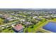 Gorgeous community view featuring well-maintained homes, lush landscaping, and picturesque lakes at 110 167Th E Blvd, Bradenton, FL 34212