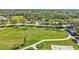 Aerial view of community park featuring lush green soccer field, walking paths, and recreational areas at 110 167Th E Blvd, Bradenton, FL 34212